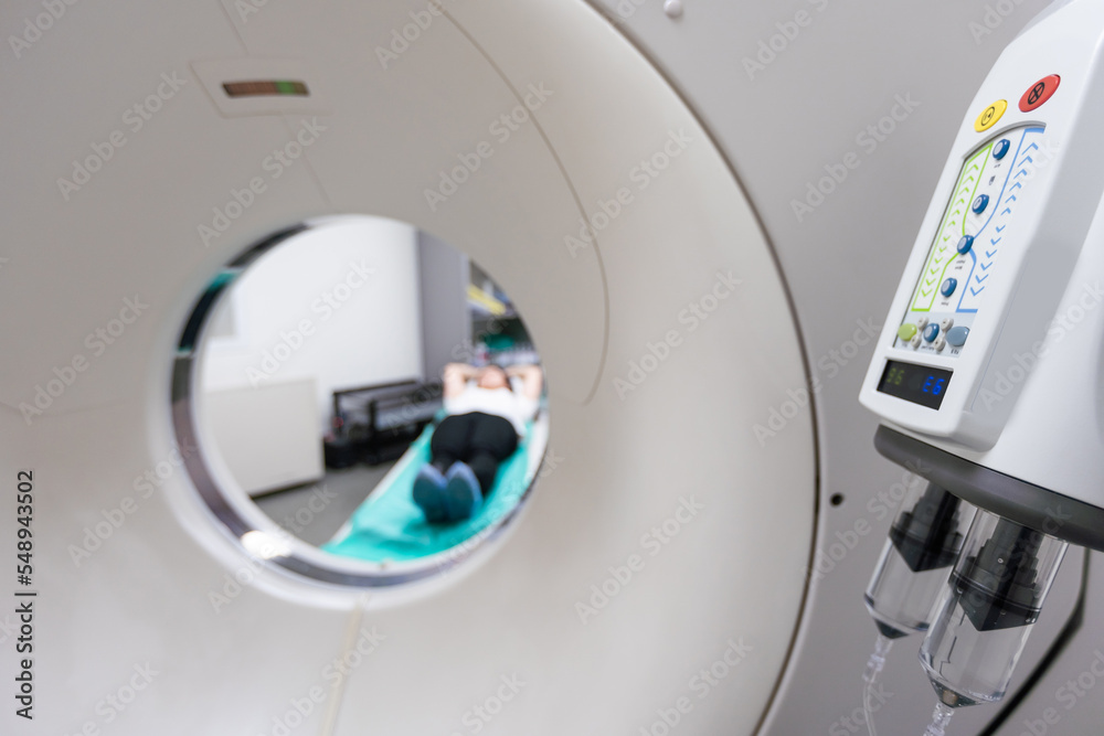 Doctor doing computed tomography for female patient stock photo. Medicine diagnostic concept Doctor doing computed tomography for female patient stock photo. Medicine diagnostic concept