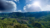 Bulgarian town Smolyan with lake, vegetation and clouds. Rhodope Mountains. Panorama, top view