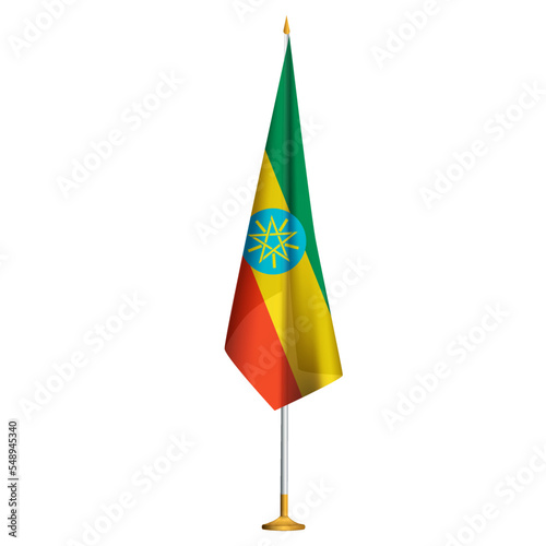 Isolated small national flag of Ethiopia vector with golden flagpole.Standing miniature Ethiopian flag