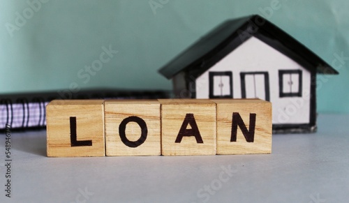 Принти на полотні Word LOAN on stack coins with white background