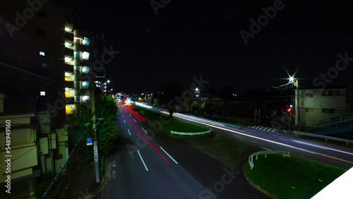 A night timelapse of the traffic jam at the downtown street in Tokyo wide shot photo