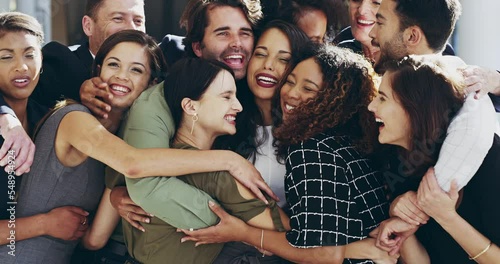 Happy group of people and friends hug in office in support and success of business teamwork. Team, diversity and united colleagues in solidarity, embrace in happiness in fun and modern workplace photo