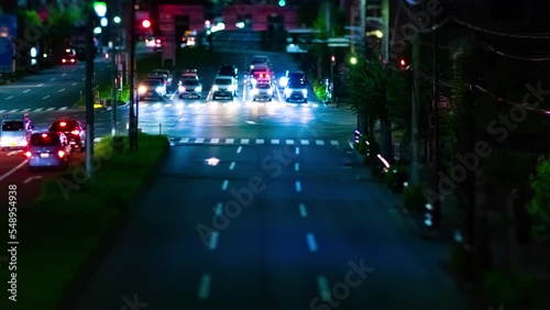 A night timelapse of the miniature traffic jam at the downtown street in Tokyo zoom photo