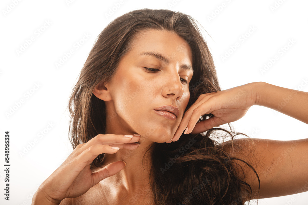 Fototapeta premium Posing while touching her skin