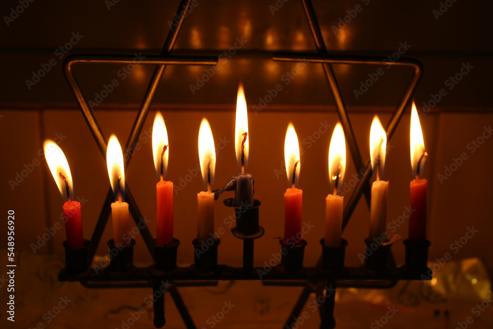 Hanukkah candles in a star of David candle stand