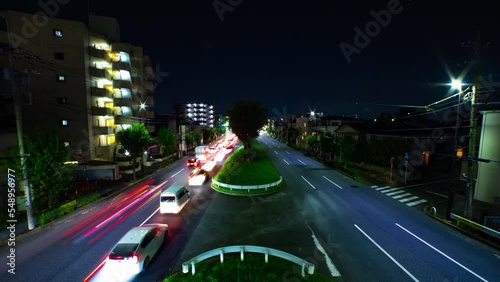 A night timelapse of the traffic jam at the downtown street in Tokyo wide shot tilt photo