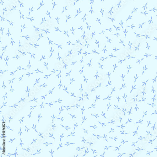 Winter seamless pattern with bird footprints on a bright-blue snowy background