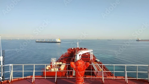 Suez, Egypt - huge container vessel proceeding through the Suez Canal. Time laps photo