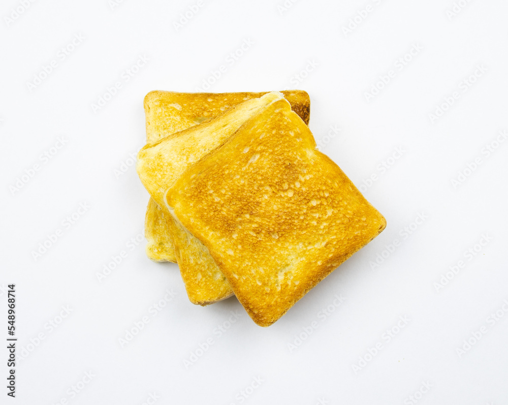 Toasted slices of bread on a white background. Cooked in a toaster.