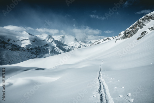 Ski tracks in deep snow in mountains, Austrian alps, Gastein, Salzburg, Austria