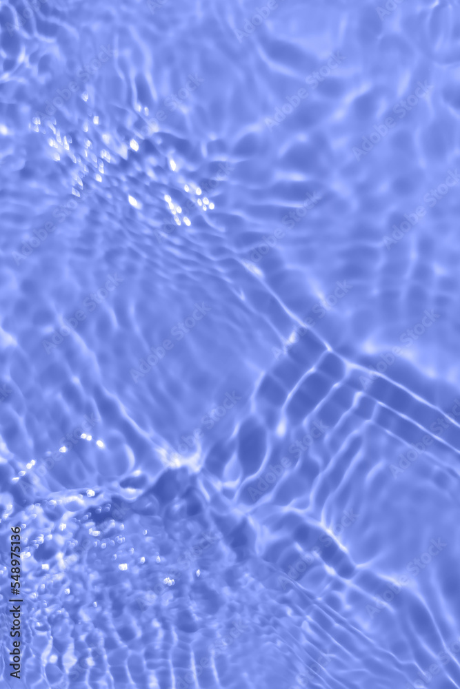 Defocus blurred transparent blue colored clear calm water surface texture with splashes and bubbles. Trendy abstract nature background. Water waves in sunlight with copy space. Blue watercolor shining Defocus blurred transparent blue colored clear calm water surface texture with splashes and bubbles. Trendy abstract nature background. Water waves in sunlight with copy space. Blue watercolor shining