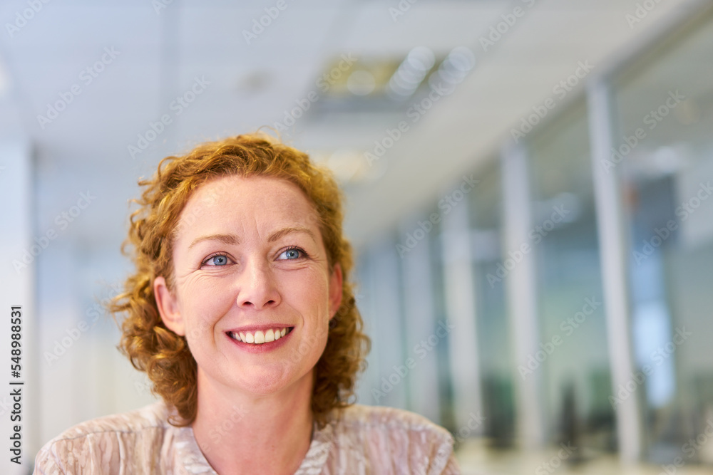 Fototapeta premium Smiling young woman as a successful business woman