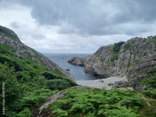 Beautiful landscape of rocks facing the sea on a cloudy day photo