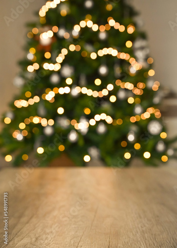  Blurred background without focus with bokeh.
Christmas table background with christmas tree bokeh.