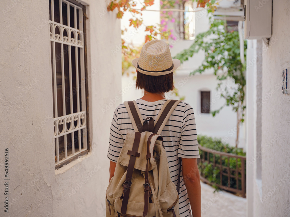 Marmaris is resort town on Turkish Riviera, also known as Turquoise Coast. Marmaris is great place for sailing and diving. Tourist Woman on Beautiful Streets of old Marmaris.
