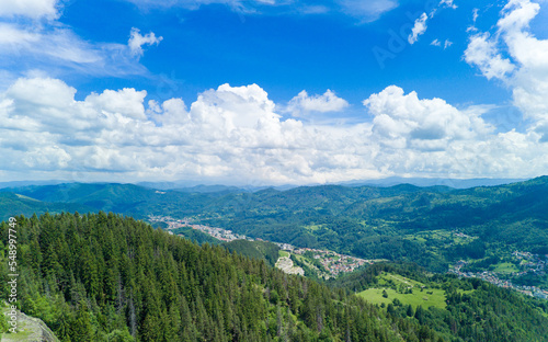 Bulgarian town Smolyan with lake, vegetation and clouds. Rhodope Mountains © YouraPechkin