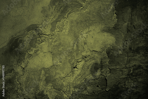Obraz na płótnie Brown green old concrete wall surface. Dark olive color. Close-up. Rough background for design. Distressed, cracked, broken, crumbled. w salonie
