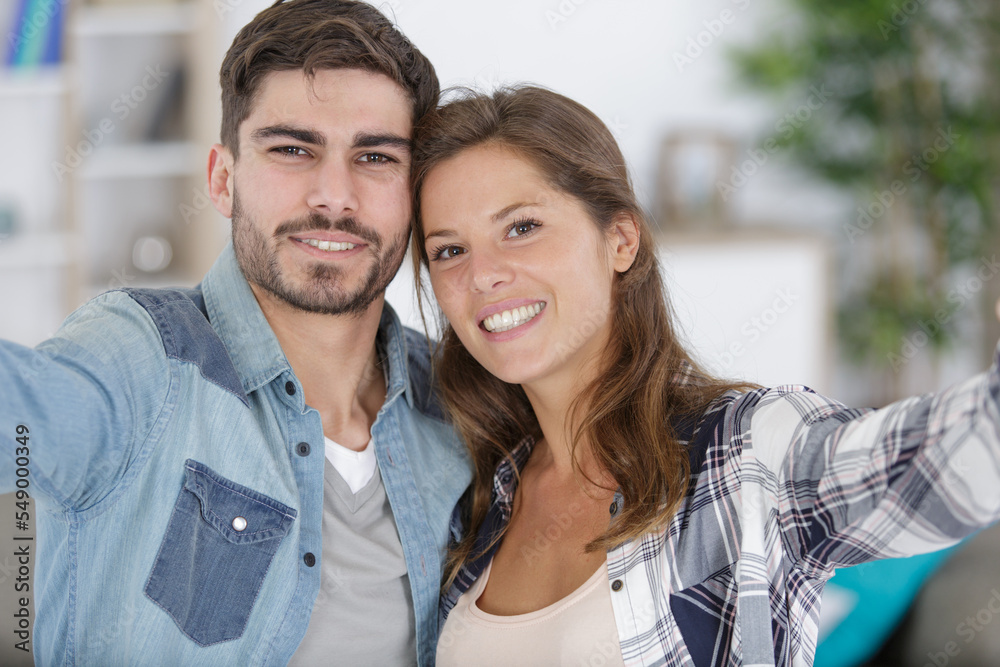 excited couple with keys to their new home excited couple with keys to their new home