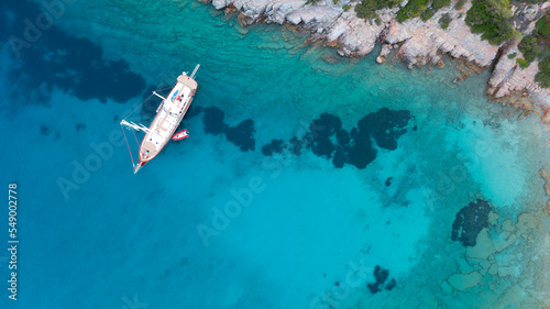 Aerial view of Sailing Gulet. A gulet is a wooden classic yacht built usually in Bodrum or Marmaris from the southwestern coast of Turkey.  photo