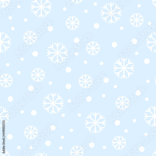 Seamless pattern of small and big snowflakes and dots. On a blue background. Kawaii style. 