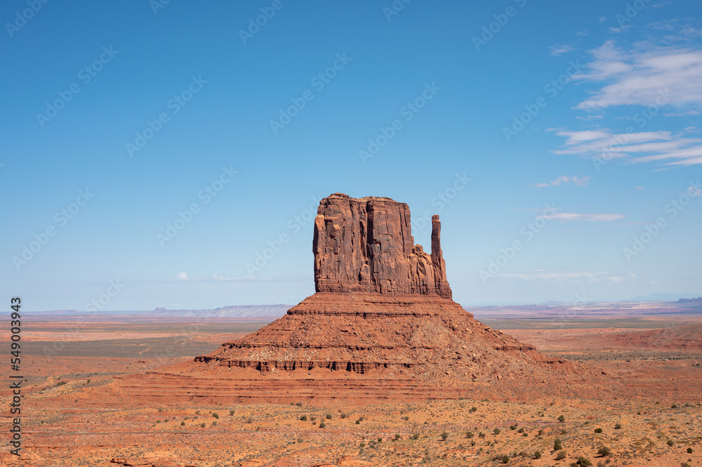 Nice desert landscape with rocky Monument Valley. It's a sunny summer day with blue sky