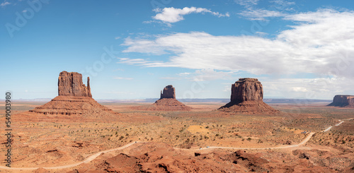 Nice desert landscape with rocky Monument Valley. It s a sunny summer day with blue sky