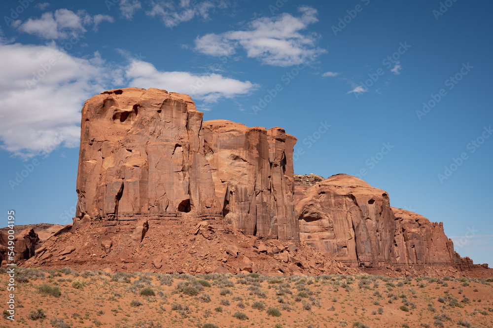 Nice desert landscape with rocky Monument Valley. It's a sunny summer day with blue sky