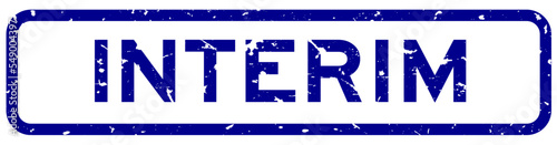 Grunge blue interim word square rubber seal stamp on white background