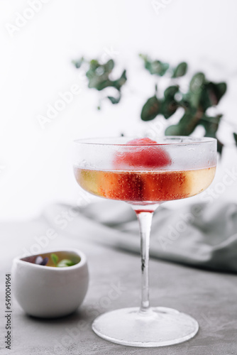 sparkling champagne cocktail with strawberry sorbet