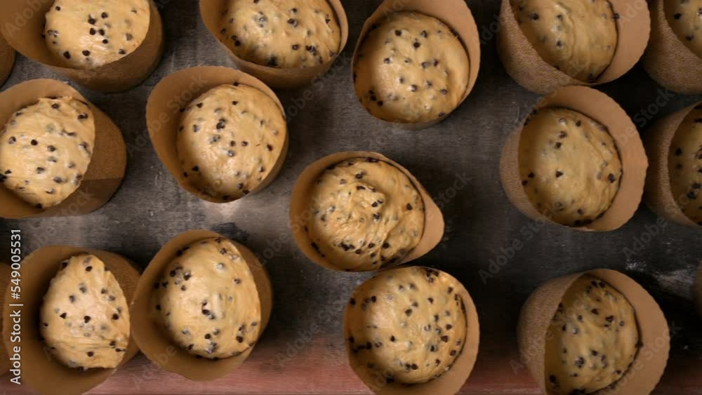 Top view of Bunch of raw leavened panettone italian christmas cake ready to bake. High quality 4k footage Top view of Bunch of raw leavened panettone italian christmas cake ready to bake. High quality 4k footage