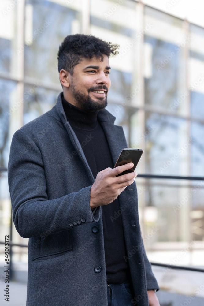 Business man outdoor portrait
Using phone and laptop outdoors Business man outdoor portrait
Using phone and laptop outdoors