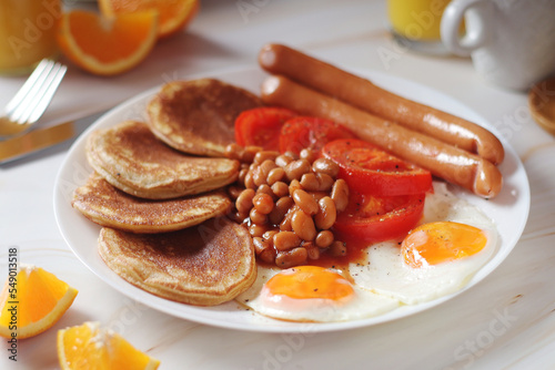 Traditional British breakfast with sausages and beans
