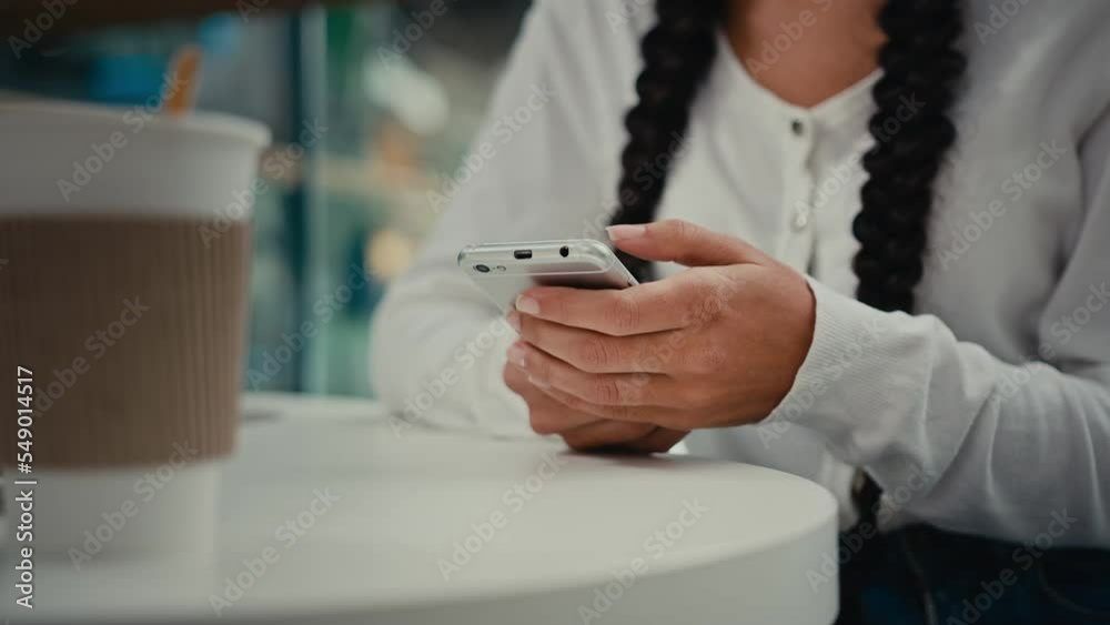 Close up woman hands answer sms message on mobile phone unknown girl student freelancer young lady businesswoman teenager sit at cafe table with cup of coffee chatting online with friends make order Close up woman hands answer sms message on mobile phone unknown girl student freelancer young lady businesswoman teenager sit at cafe table with cup of coffee chatting online with friends make order