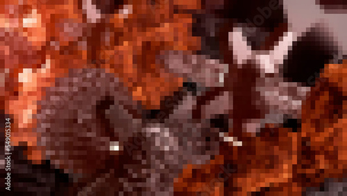 Glowing pixels. Motion.An orange-dark mosaic that moves in animation.