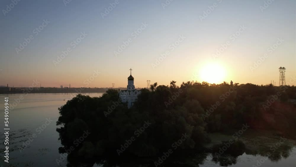 Flight over the temple of the Orthodox Church on the island in Ukraine bridge and sunrise. Flight over the temple of the Orthodox Church on the island in Ukraine bridge and sunrise.