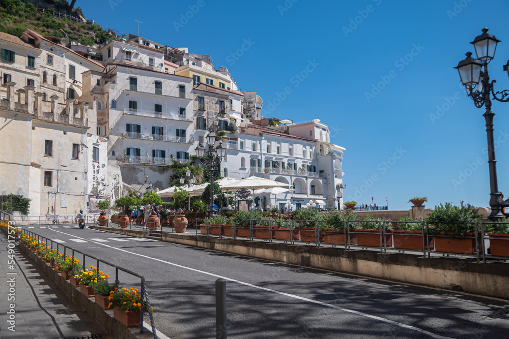 Fototapeta premium Bathed in the Italian summer sun, the embankment in the resort town of Amalfi, Italy.