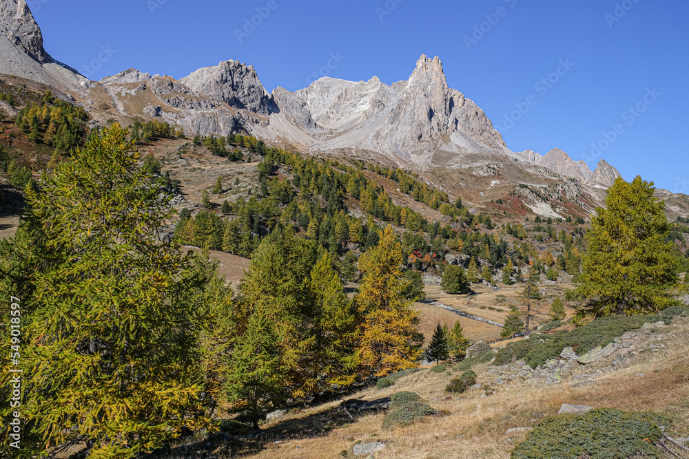  View of the scenic Valee de la Claree in the French Alps with Massif de Cerces mountains on either side of the valley, near Briancon, France