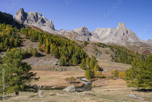 View of the scenic Valee de la Claree in the French Alps with Massif de Cerces mountains on either side of the valley, near Briancon, France