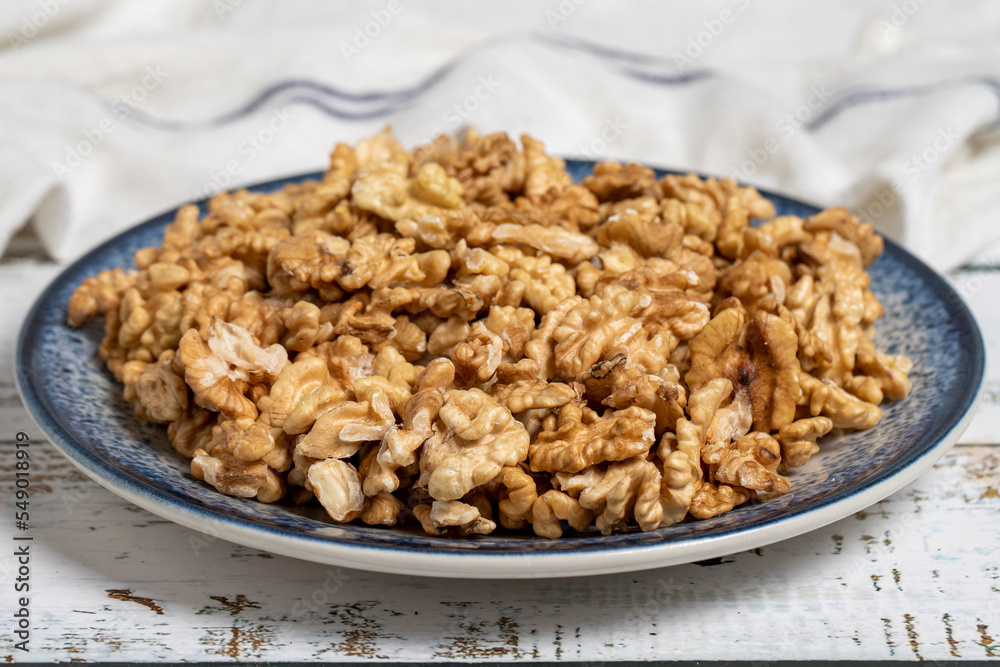 Walnut kernel on wood floor. Nuts. Healthy food. close up Walnut kernel on wood floor. Nuts. Healthy food. close up