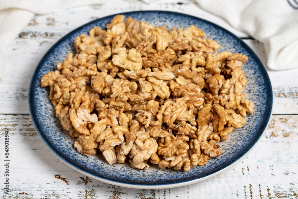 Walnut kernel on wood floor. Nuts. Healthy food. close up Walnut kernel on wood floor. Nuts. Healthy food. close up
