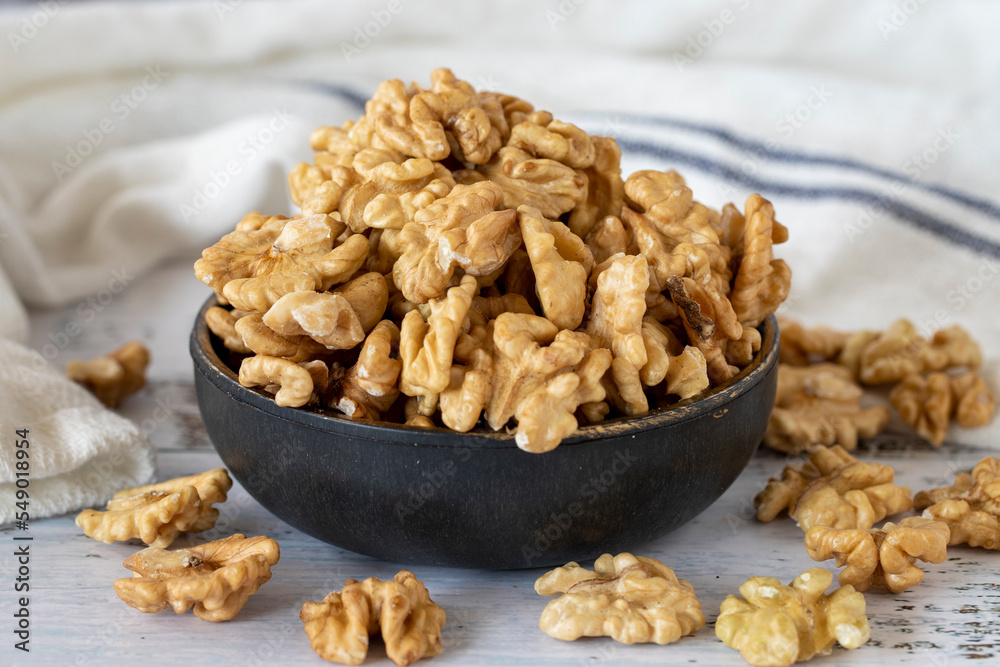 Walnut kernel on wood floor. Nuts. Healthy food. close up