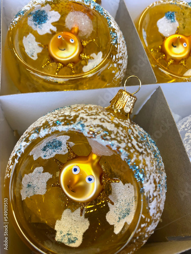 Photography Hand blown glass Christmas ornaments with golden sun inside the ball