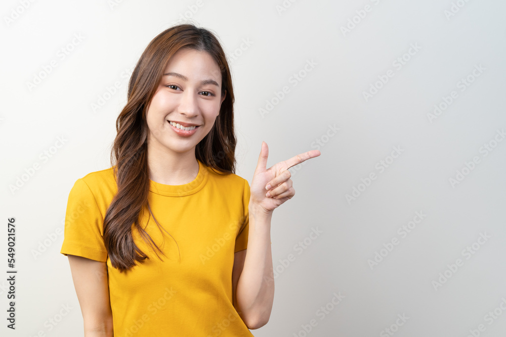 Asian young woman pointing finger show service to customer Asian young woman pointing finger show service to customer