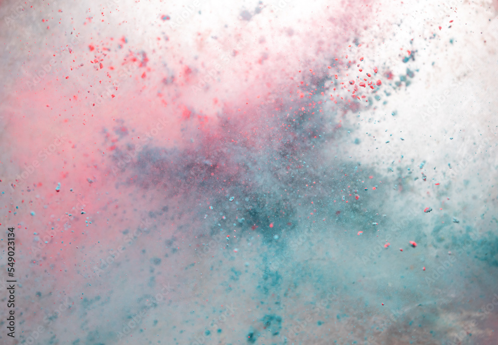 Colored powder explosion isolated on black background