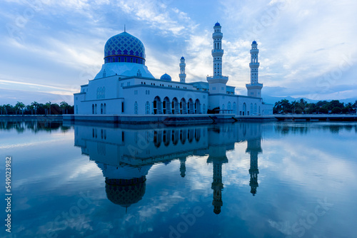 The floating City Mosque, also known as Likas Mosque at Kota Kinabalu, Sabah, Malaysia at dawn just before sunrise. photo