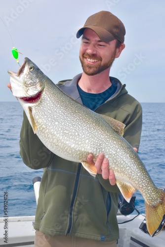 An angler with a lake trout 