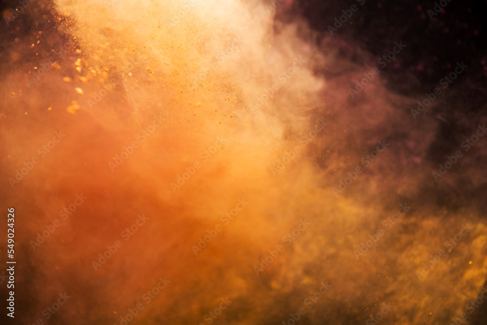 Colored powder explosion isolated on black background