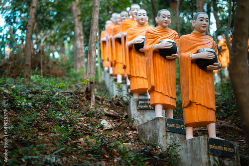 Fényképezés Statues of Monks With Alms Bowls, Phnom Sambok Pagoda, Cambodia