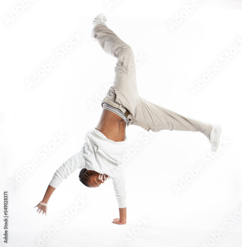Teenagers: Head Over Heels. A moment of spontaneous fun from a late teenage boy, action photo with motion blur. From a series of related images.