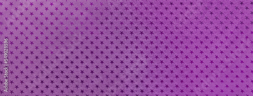 Dark violet christmas background from metal foil paper with a pattern of sparkling stars, macro. Purple backdrop.